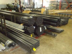 Stacks of steel pipes and metal tubing are stored inside a warehouse in Philadelphia, PA