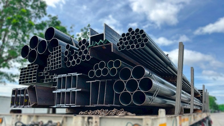 Stacked structural steel pipes on a transport trailer in Philadelphia, PA